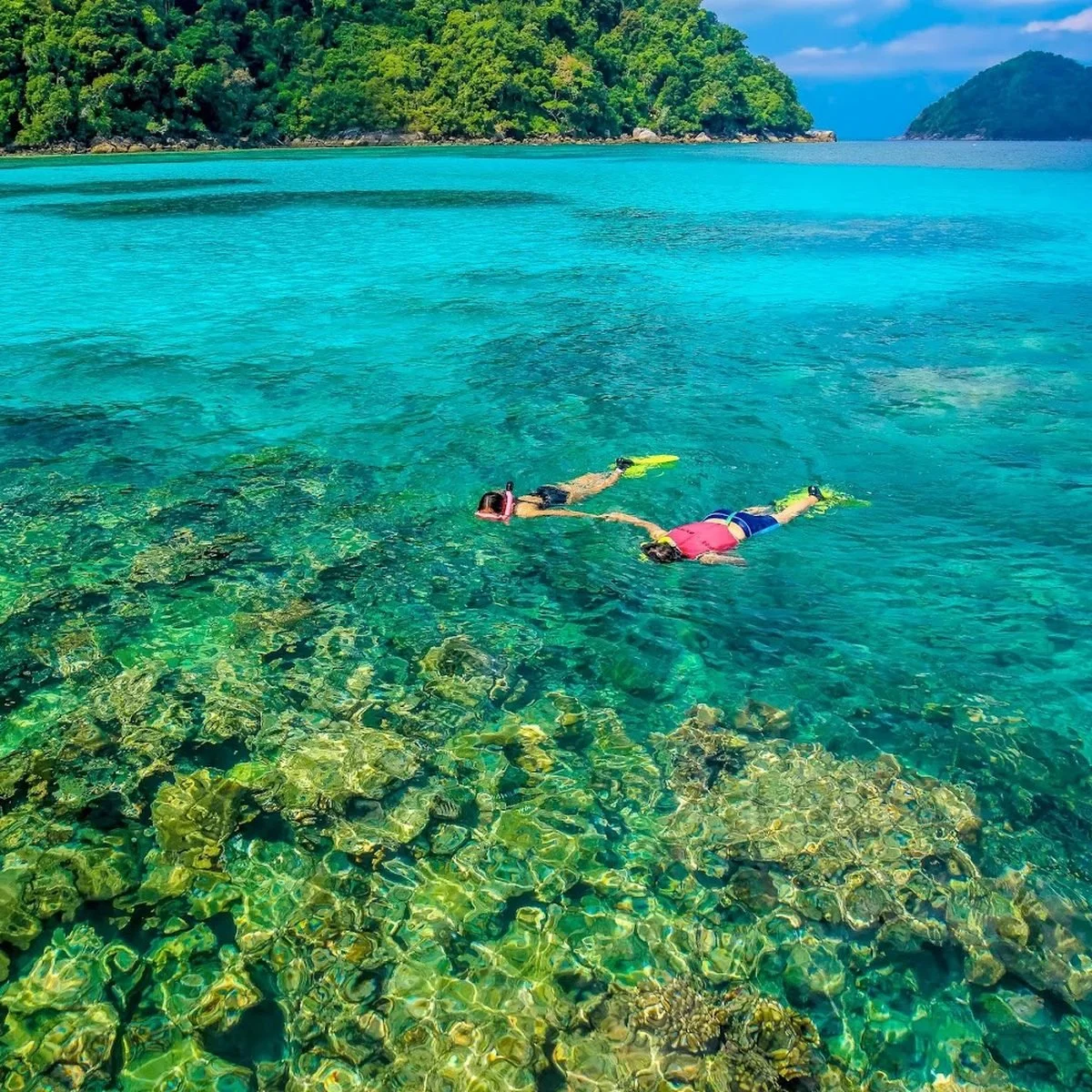Snorkeling over coral reef at the Surin Islands Thailand