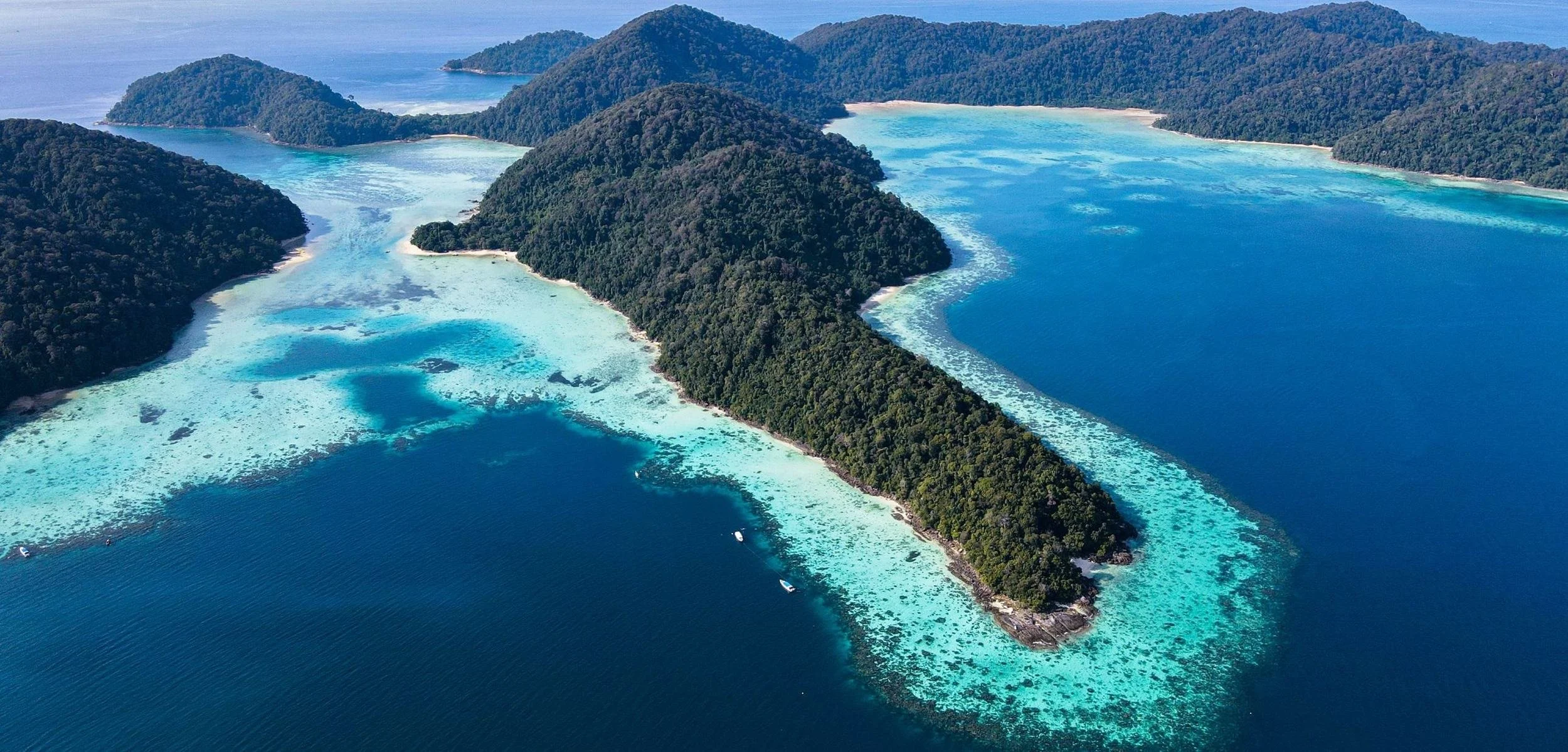 Aerial view of the Surin Islands coral reefs and turquoise water Thailand