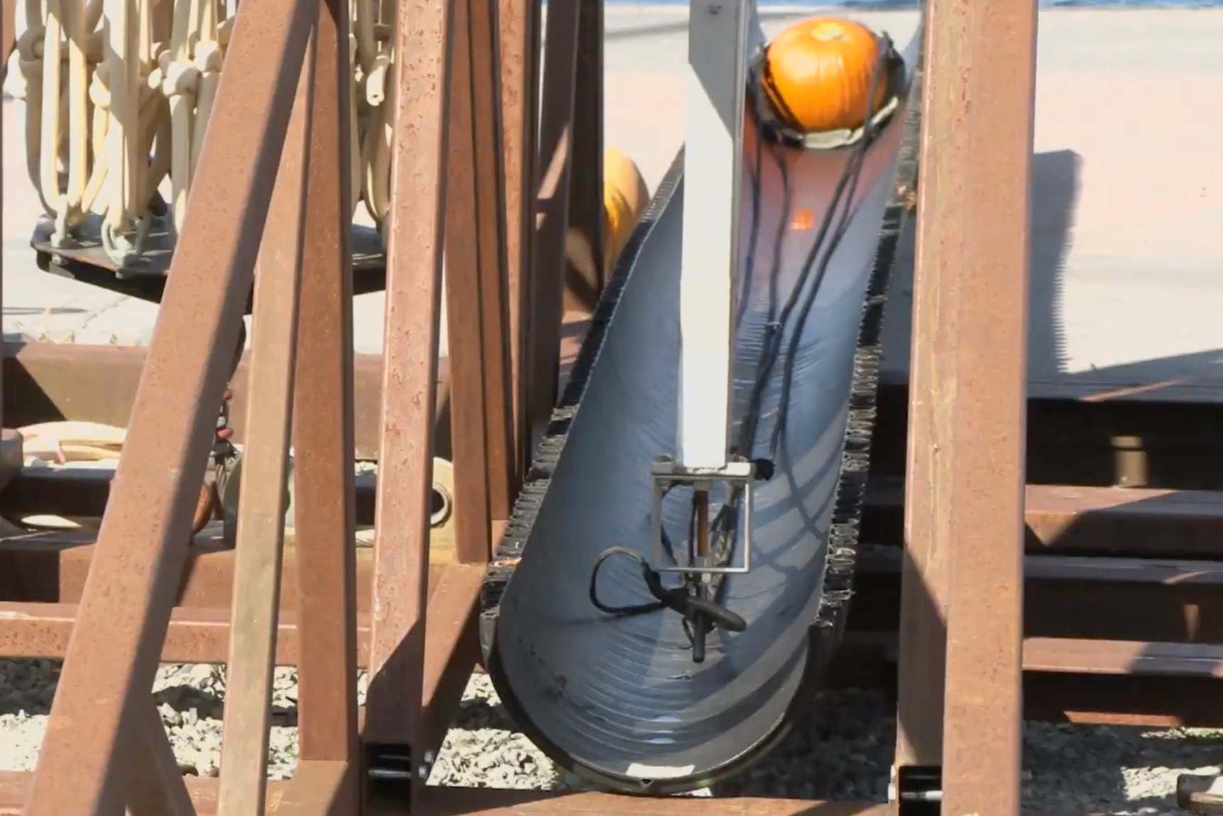 a pumpkin sits in the barrel of a trebuchet for a pumpkin launching contest held in Clayton