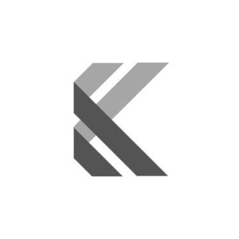A grayscale stylized geometric logo with layered angular shapes creating a 'K' shape.