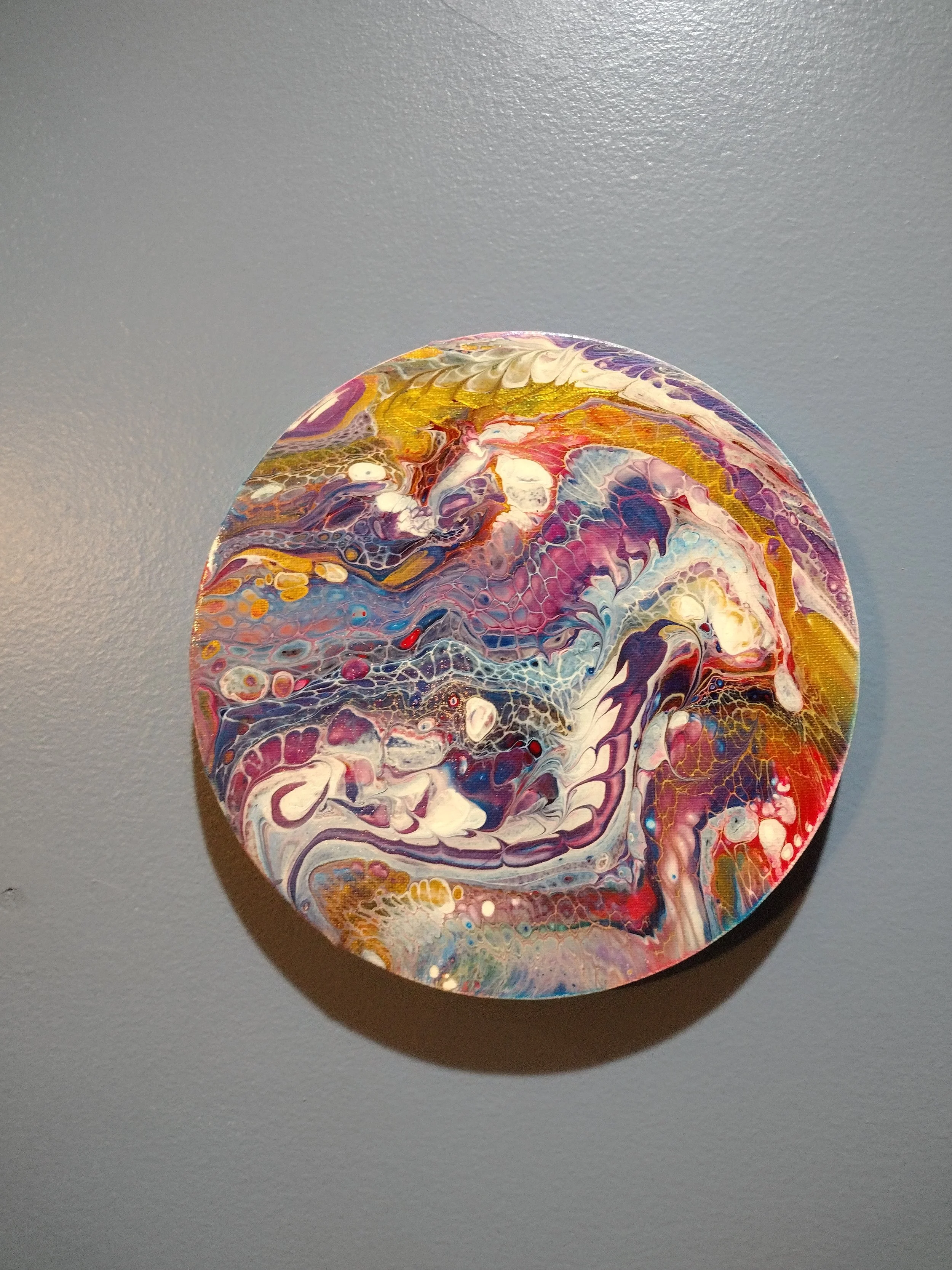 The "Color of Happy" is a celebration of joy expressed through color and movement. Layers of vibrant blues, purples, golds, reds, and whites flow together in a lively composition filled with intricate cells and fluid textures. Created using the unpre