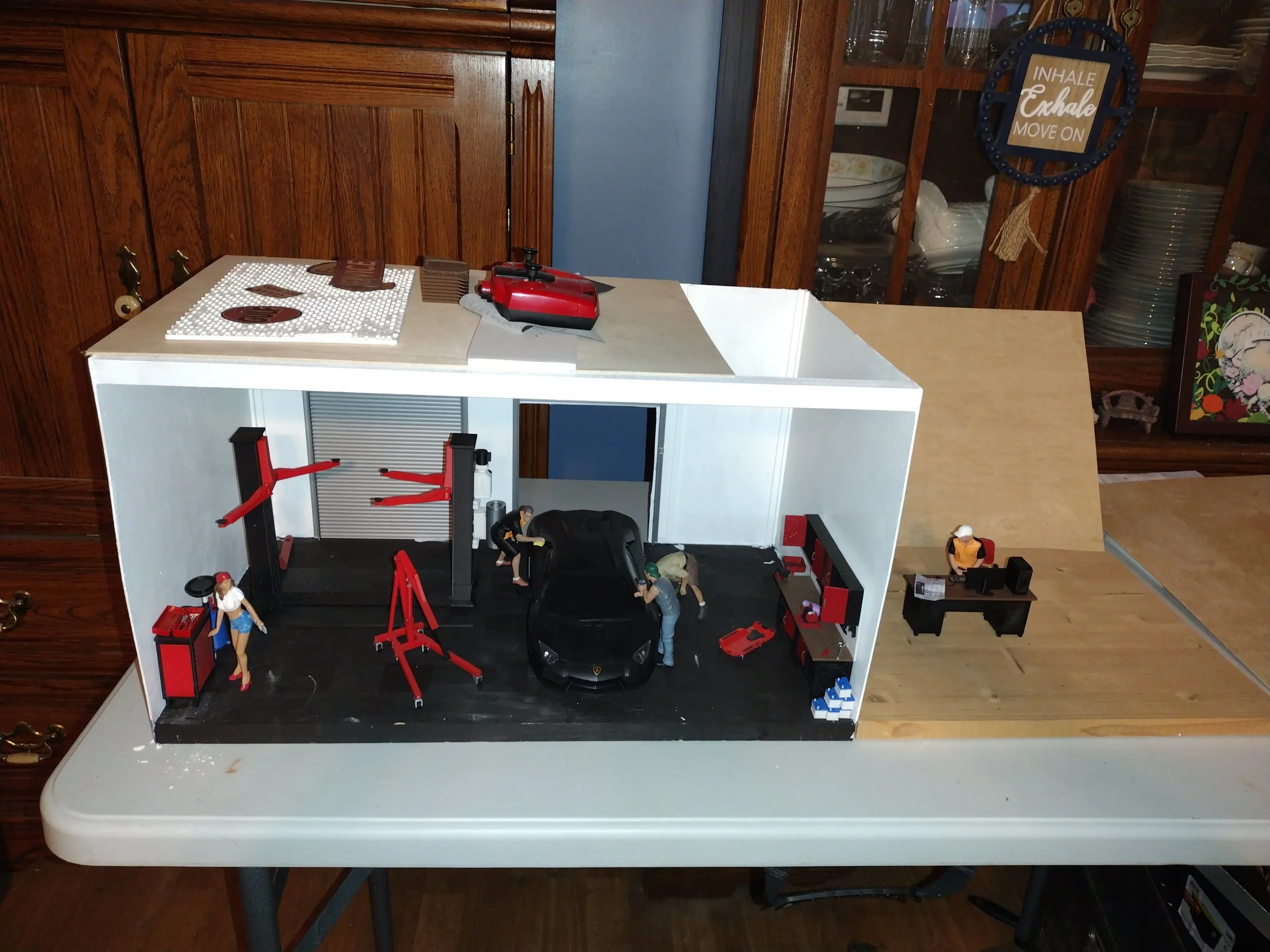 The Garage Project is an original 1:18 scale miniature garage being built from the ground up, one detail at a time. From the walls and workspace to the tools, equipment, and finishing touches, every stage of the build brings the scene closer to life.