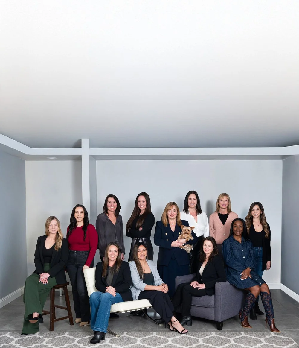 Group of professional women and one dog in a modern living room