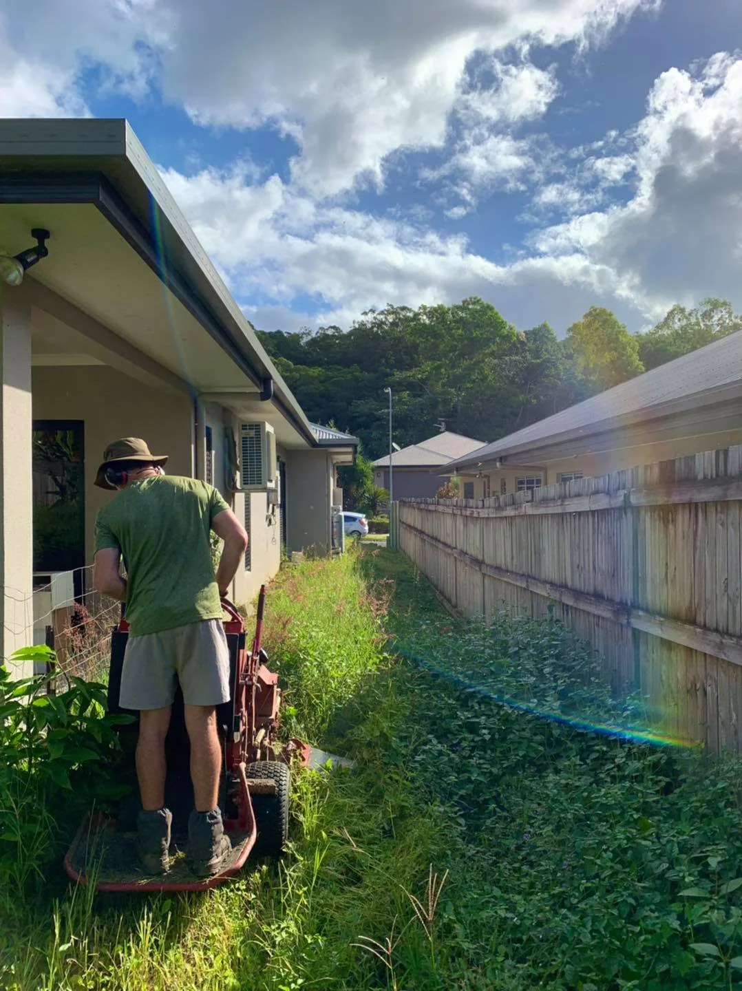 overgrown lawn in Trinity Beach Cairns get cut back to a neat and maintainable state