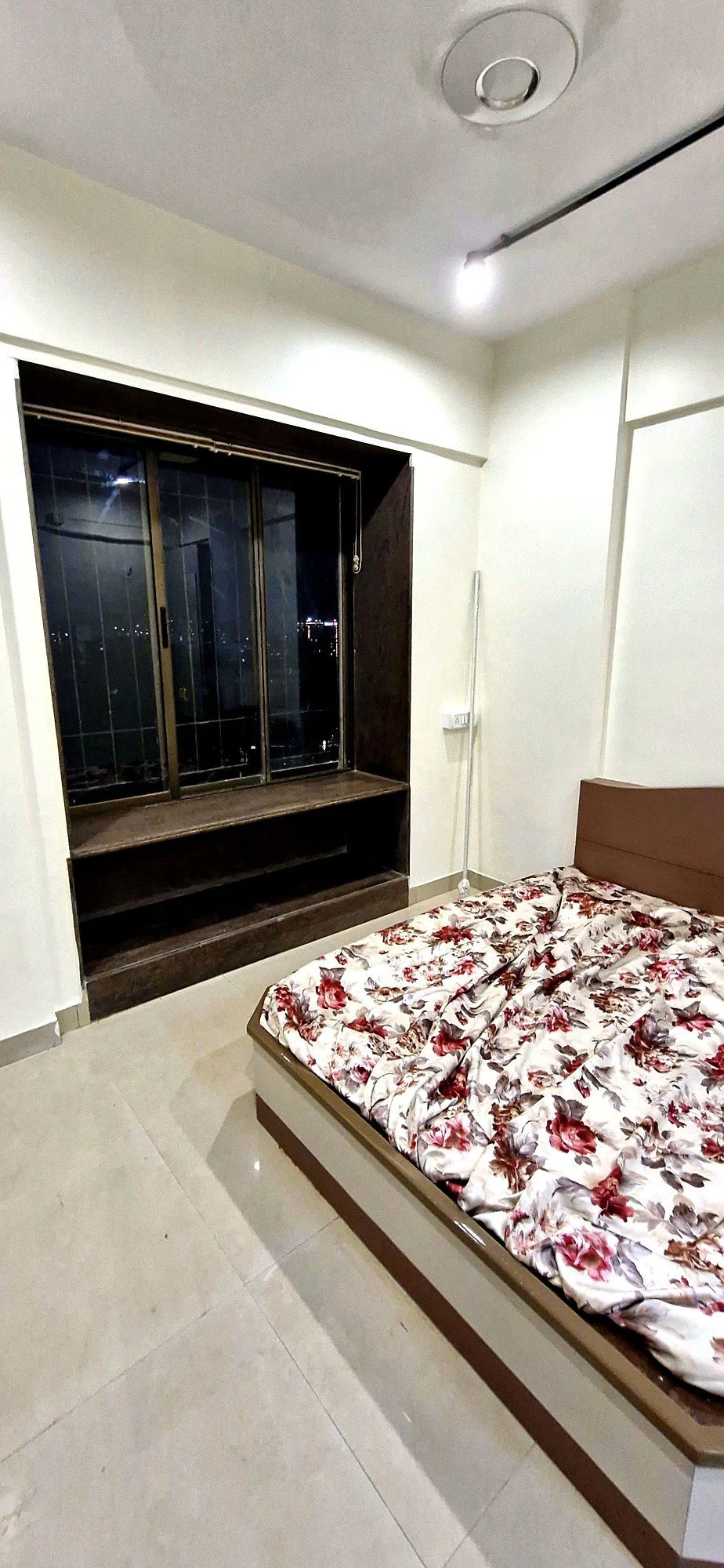 Renovated bedroom with custom wardrobe unit at Lake Pleasant Powai 2BHK