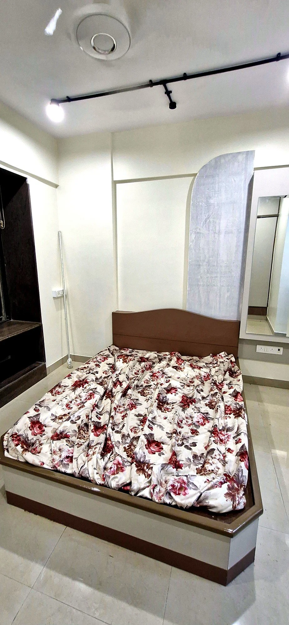 Custom wardrobe wall in renovated bedroom at Lake Pleasant Powai 2BHK