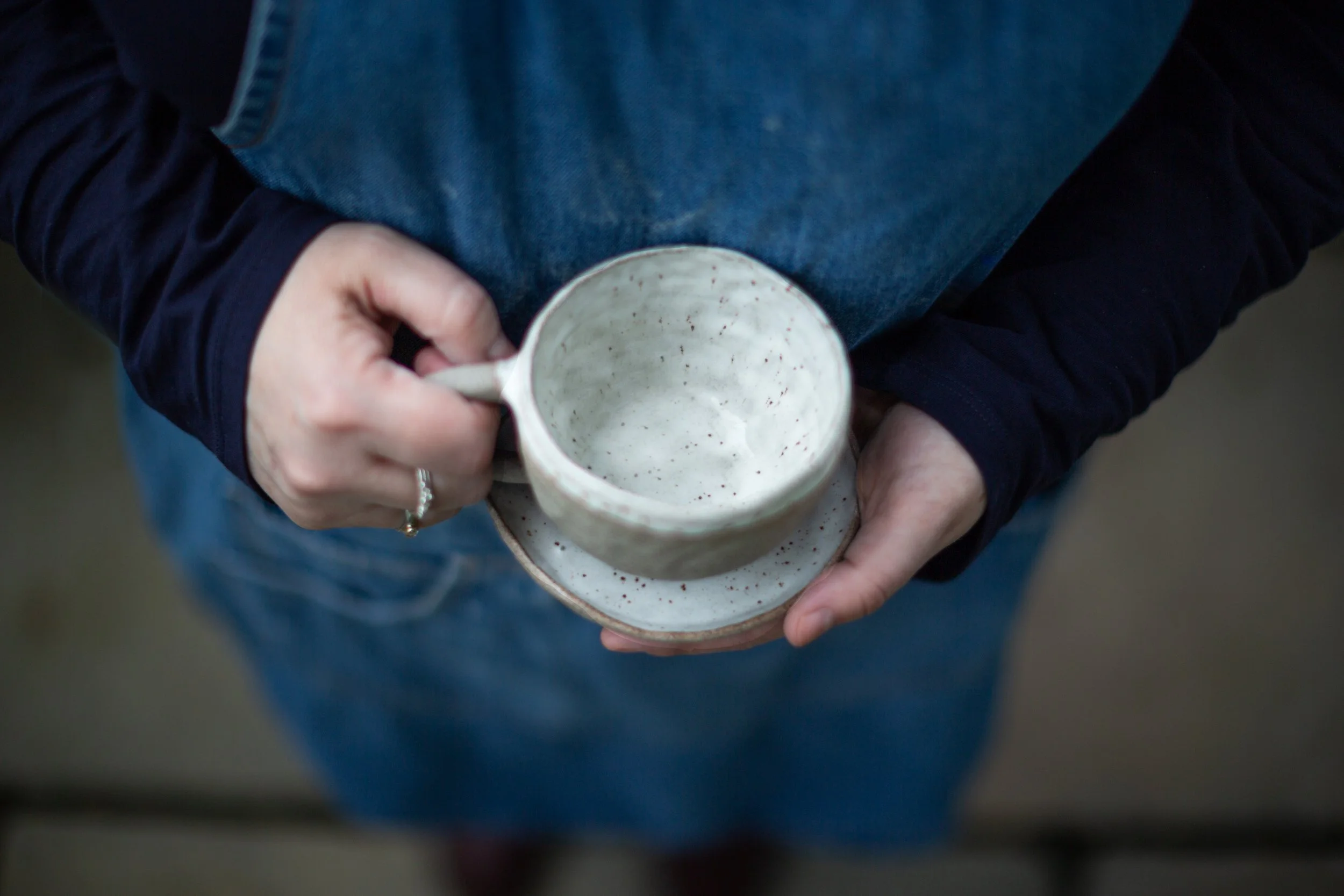 hand-shaped teacup and saucer
