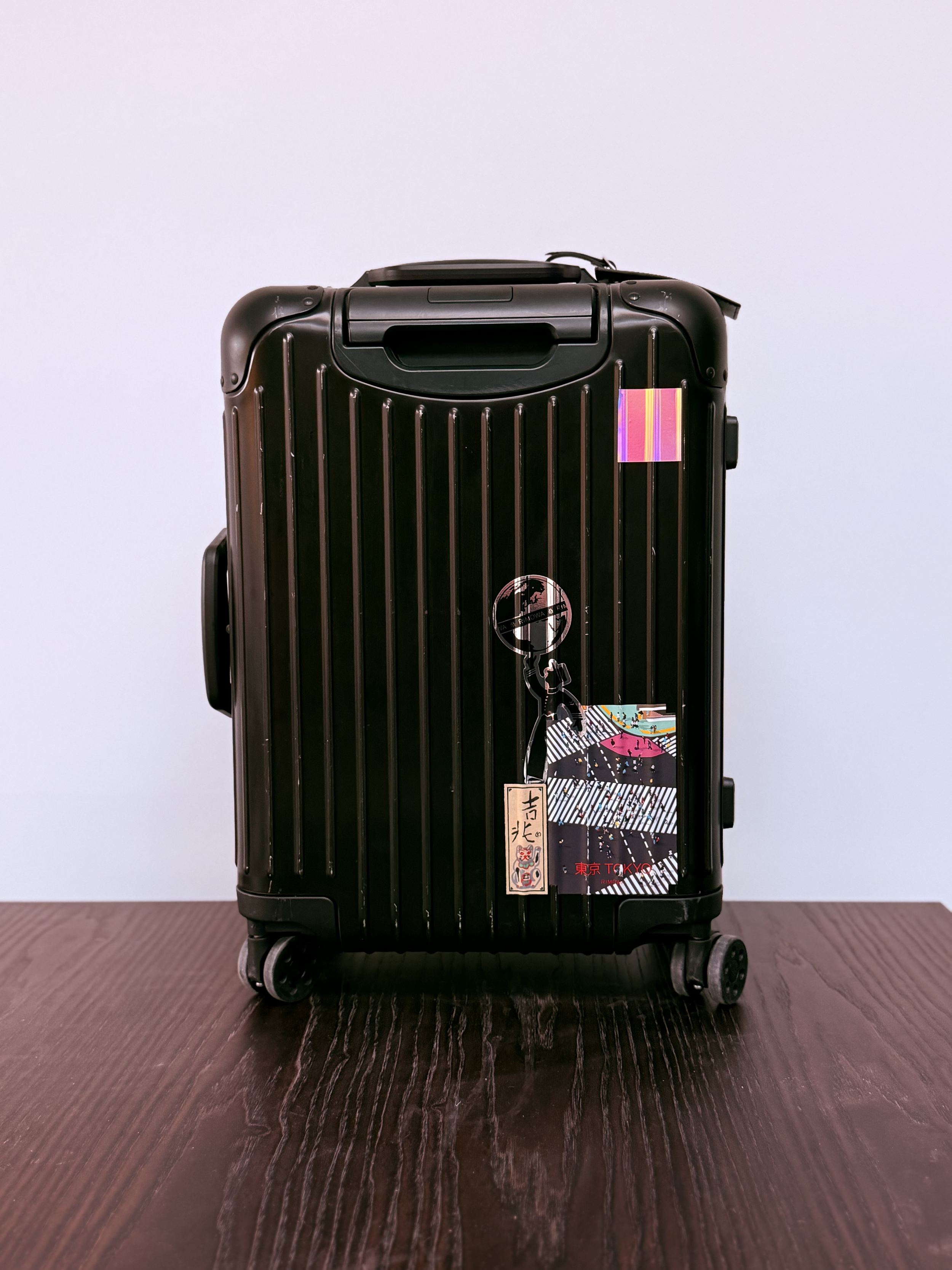 Black suitcase VALISE NOIRE' and 'BESPOKE TRAVEL' Luxury travel agency. Travel advisory. Valise Noire travel and bespoke luxury travel planning and private travel concierge and luxury travel itineraries