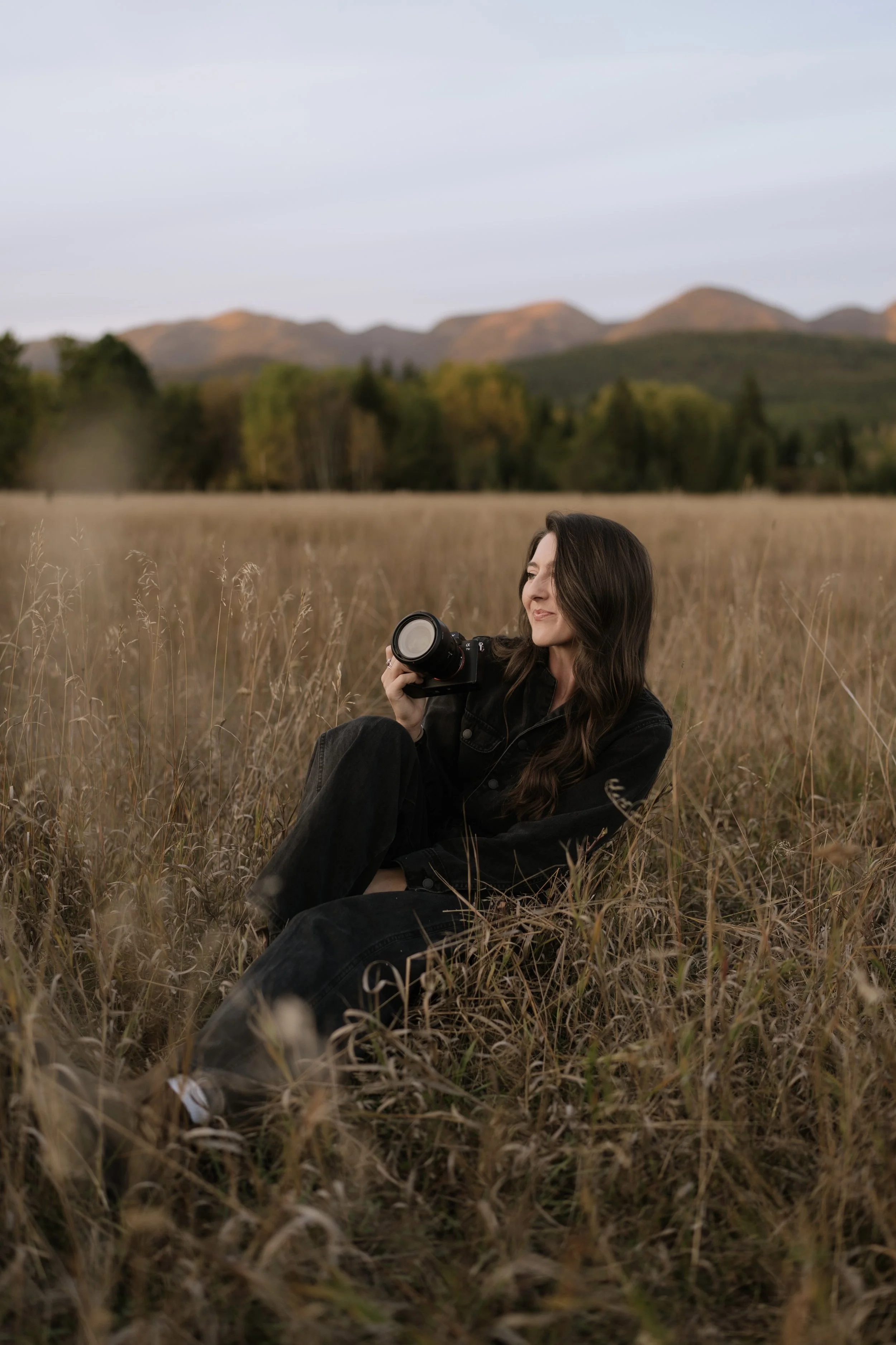 Candid portrait of wedding and elopement photographer Makayla outdoors in Montana.