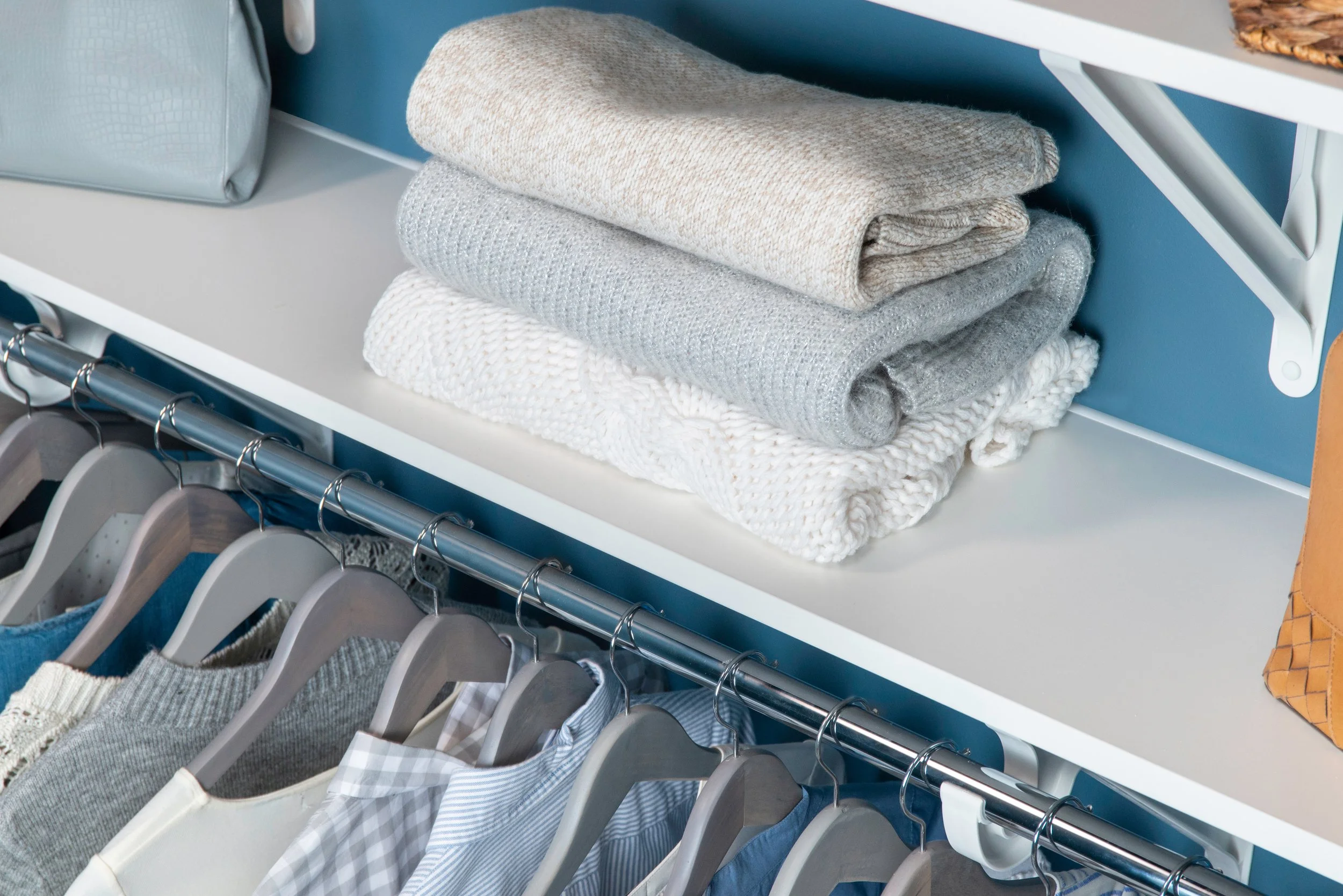 white closet shelf with hanging rod