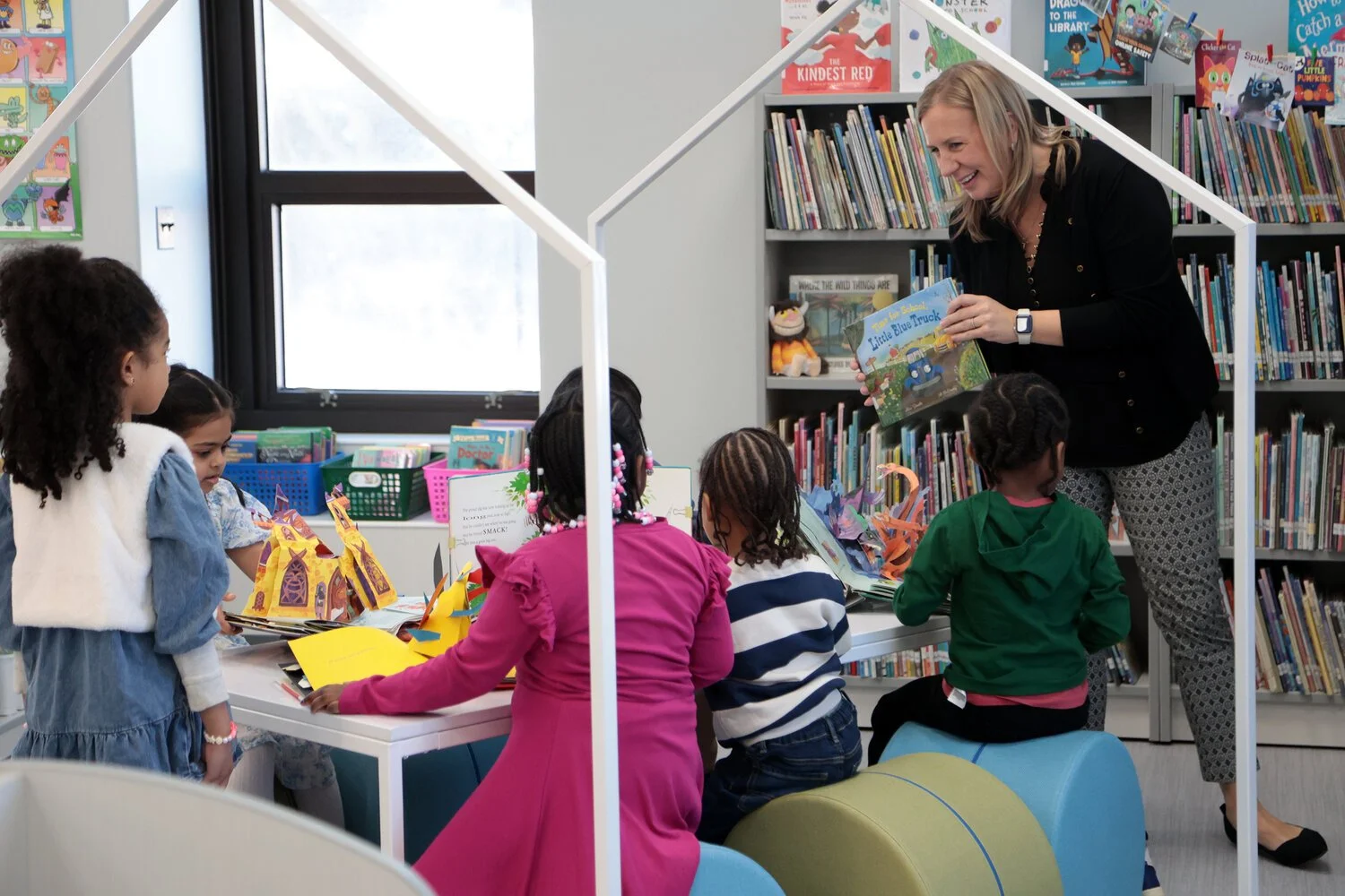   Wildermuth greeted students as they explored new books in the redesigned library space.    