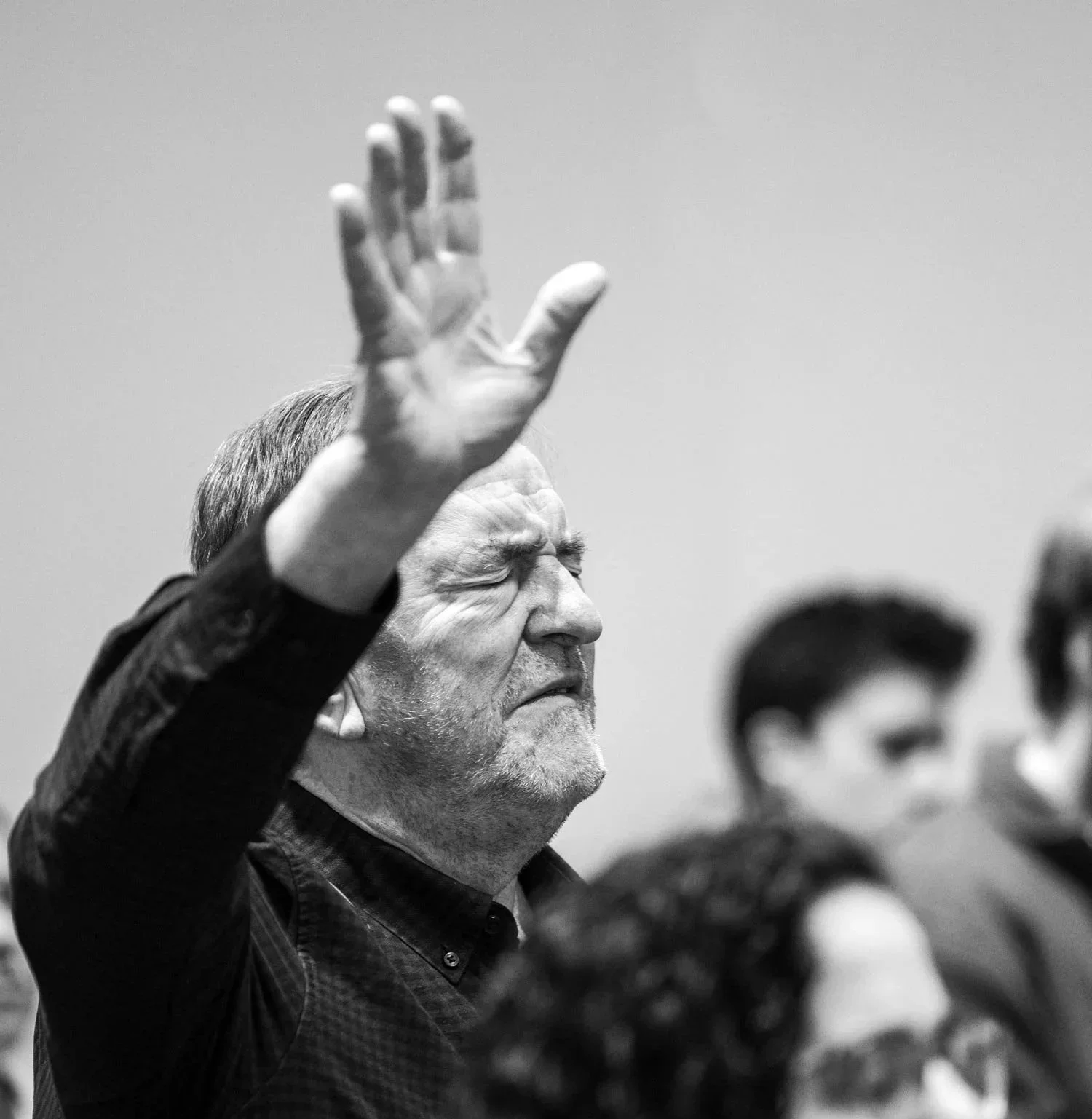 Man worshipping at Falkirk Vineyard Christian Church community