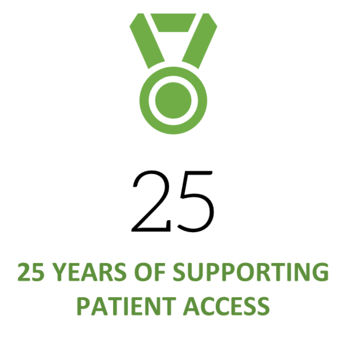 Close-up of a small green cactus with a single blooming white flower in a black pot on a white background.