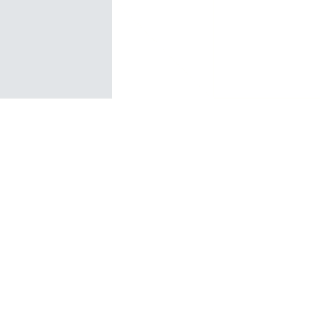 An abstract geometric design featuring black, white, gray, and light gray triangles and rectangles.