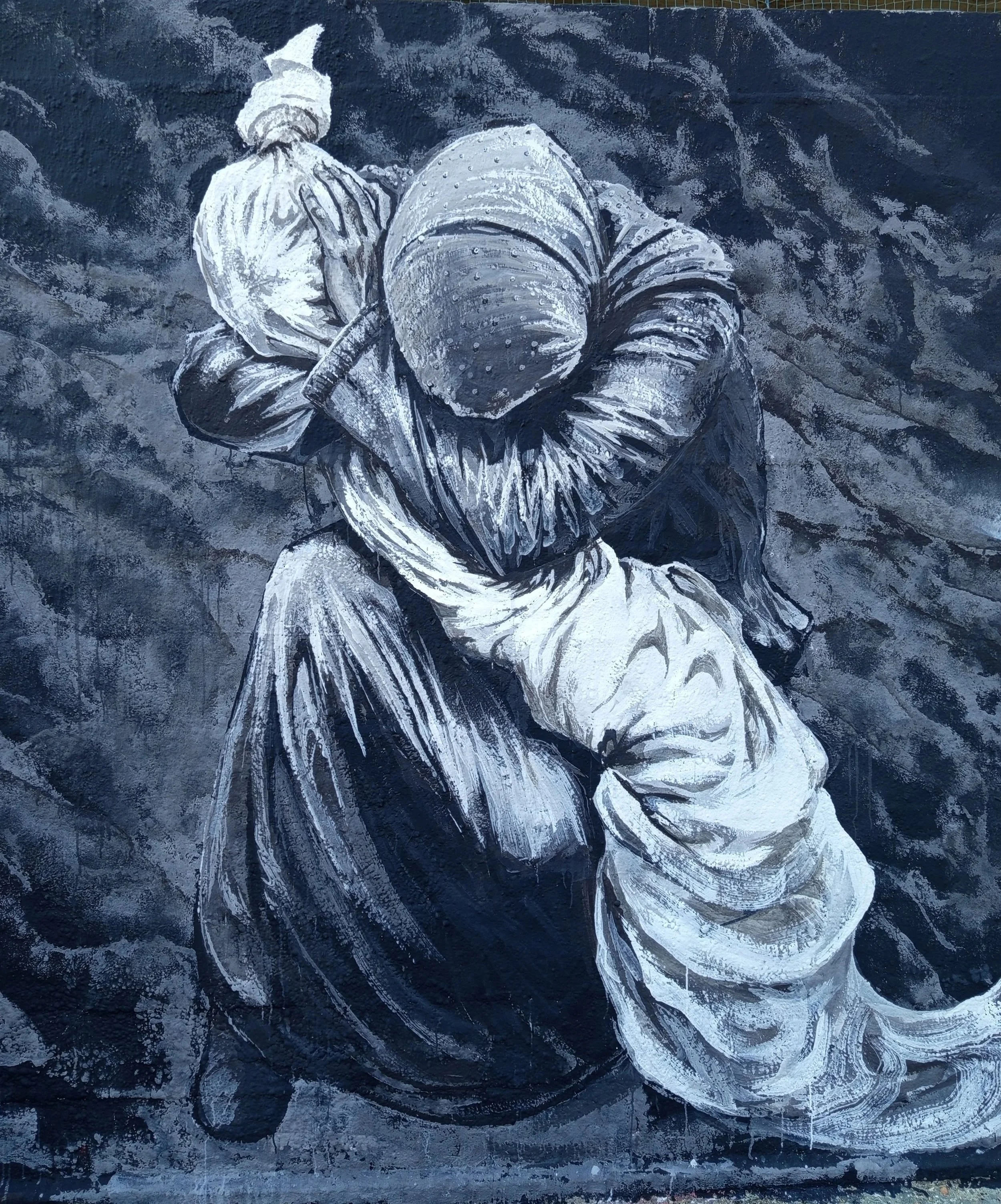 Seamos familia street art mural for Palestine by Juan Kantor