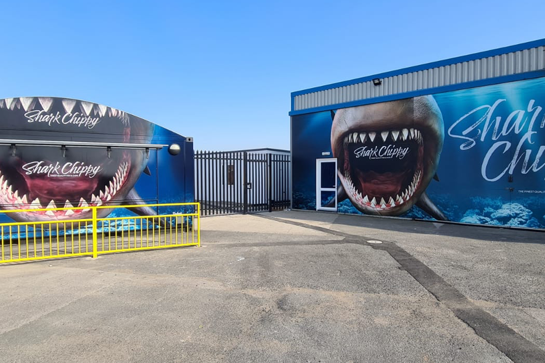 A photograph showcasing the large wall graphics completed for Shark Chippy in Blackpool.