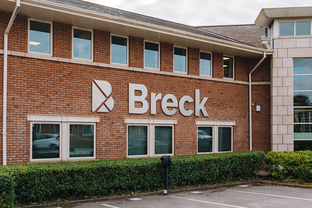 A photograph depicting external signage using built-up letters for Breck Homes.