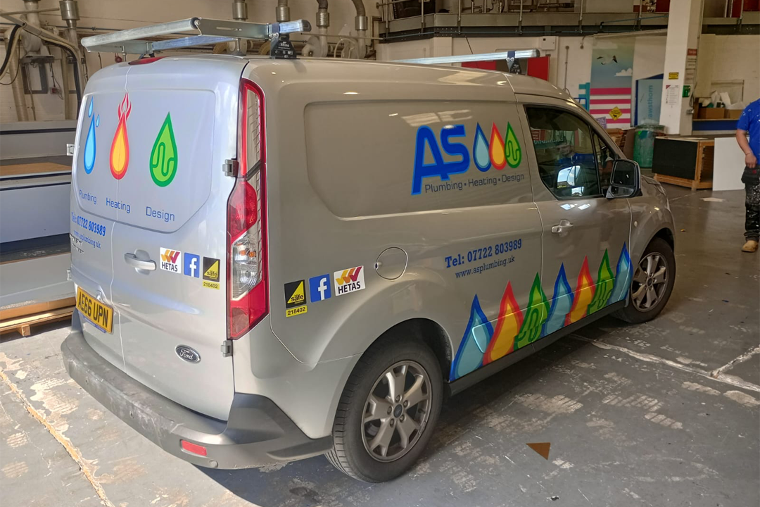 A photograph showing a vehicle wrap job completed for AS Plumbing Services.