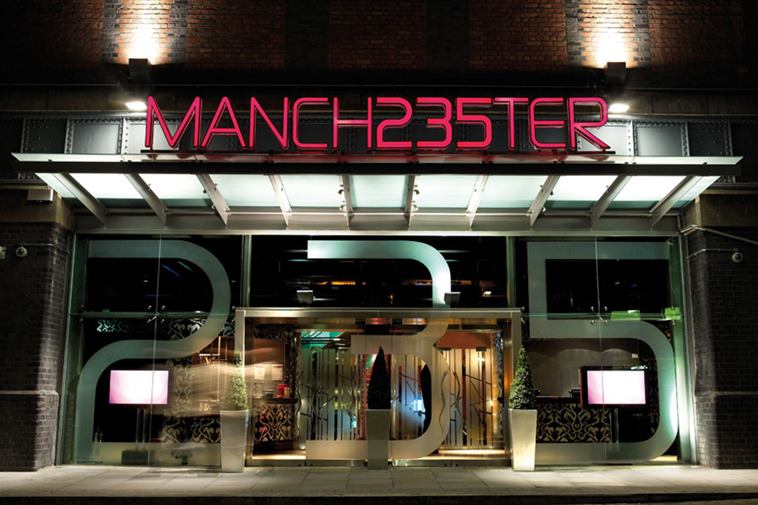 A photograph showcasing external signage for Manchester 235 Casino.
