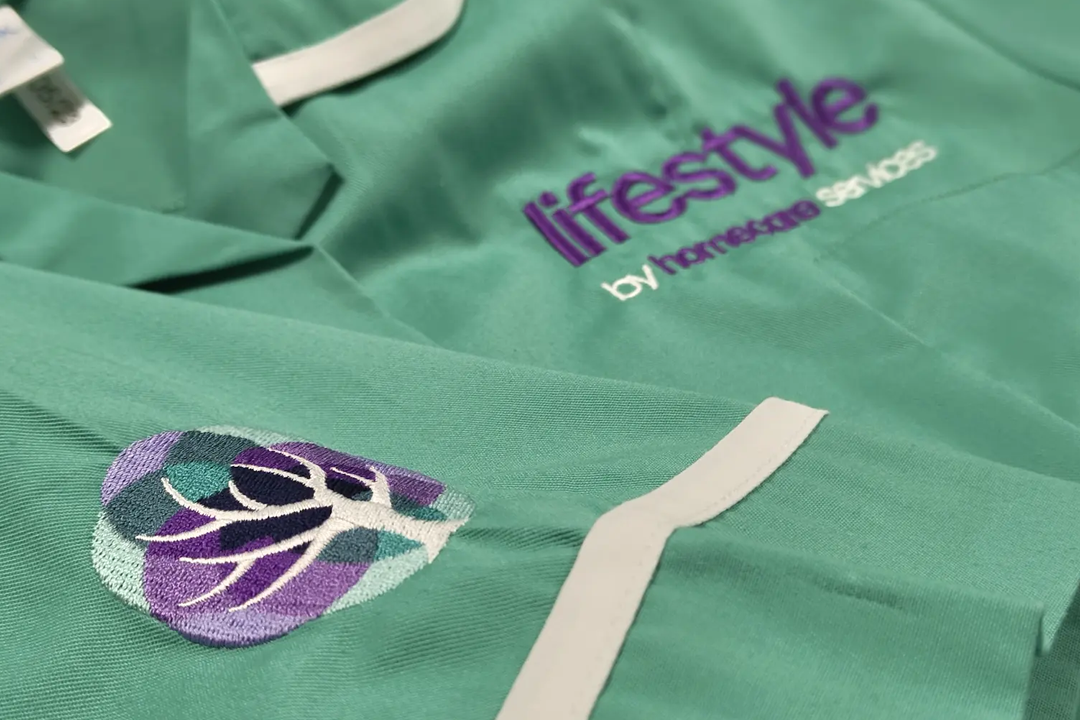 A close-up photograph showcasing embroidery for Lifestyle Homecare Services.