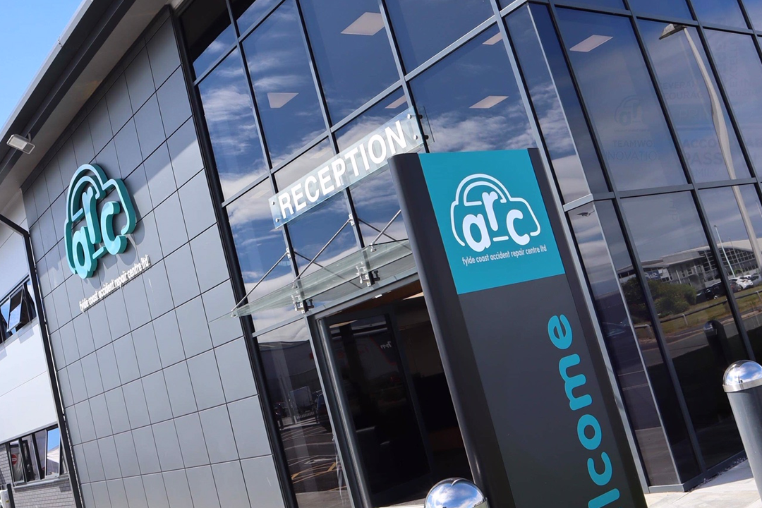 A photograph depicting external signage for the Fylde Coast Accident Repair Centre.