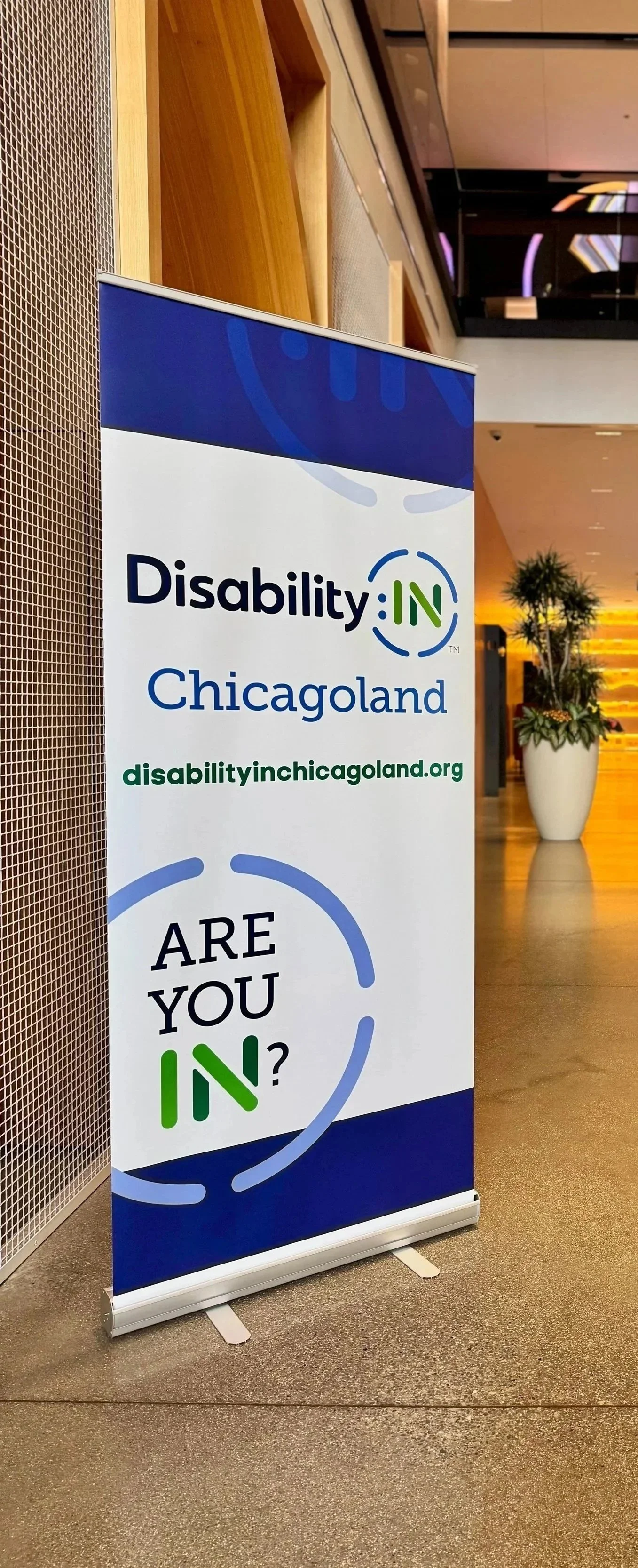 Disability:IN Chicagoland standup banner with the logo and disabilityinchicagoland.org - below reads ARE YOU IN?