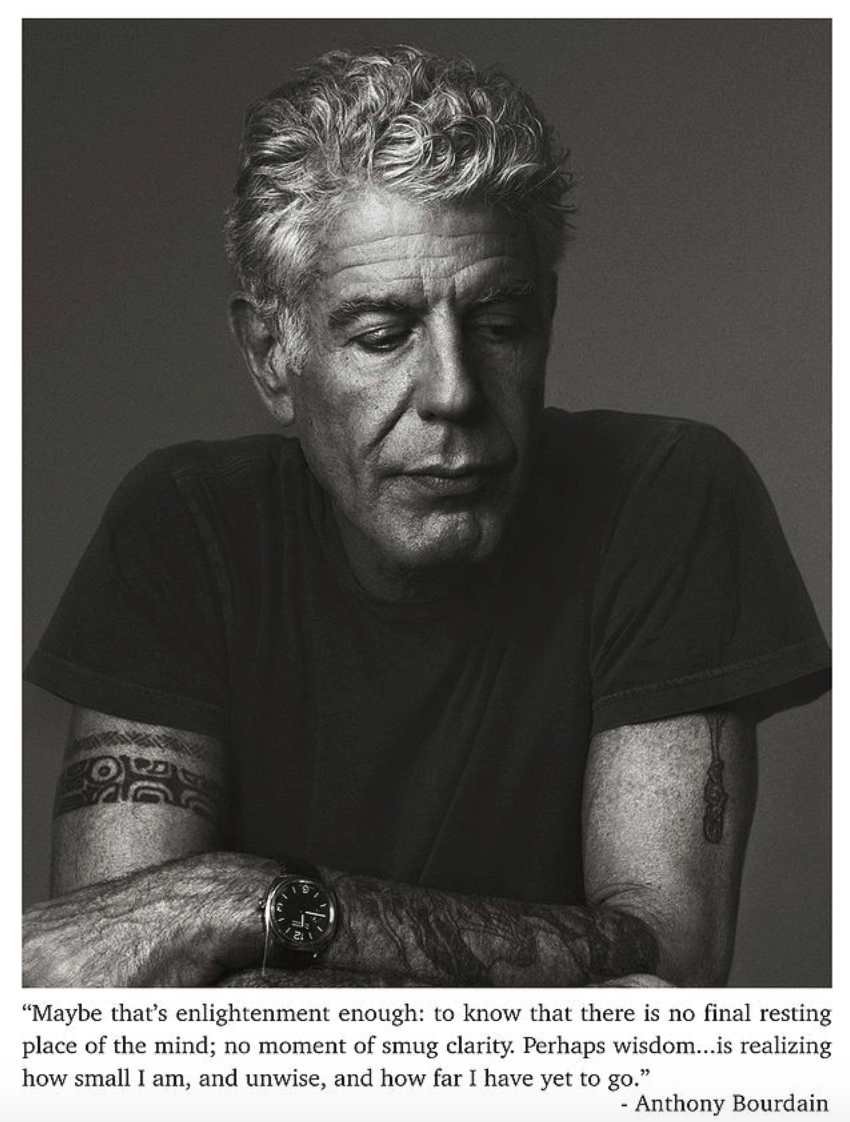 Image shows Anthony Bourdain in black and white. He is leaning forward with arms crossed, looking down and to his left. His quote about enlightenment is underneath the photo.