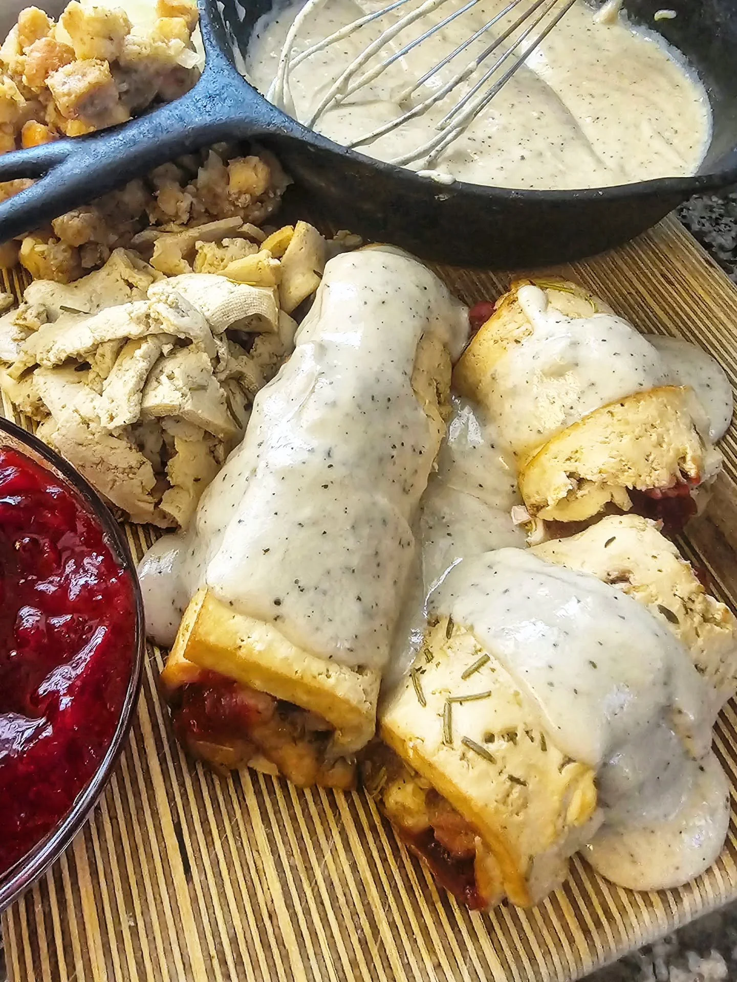 Whether you're plant-based or not, youre gonna want to save this leftovers recipe idea for this Thanksgiving!  Stuffed with dressing and homemade cranberry sauce, and topped with sage gravy, these Turk'y Tofu Rollups are filled with all the flavors y