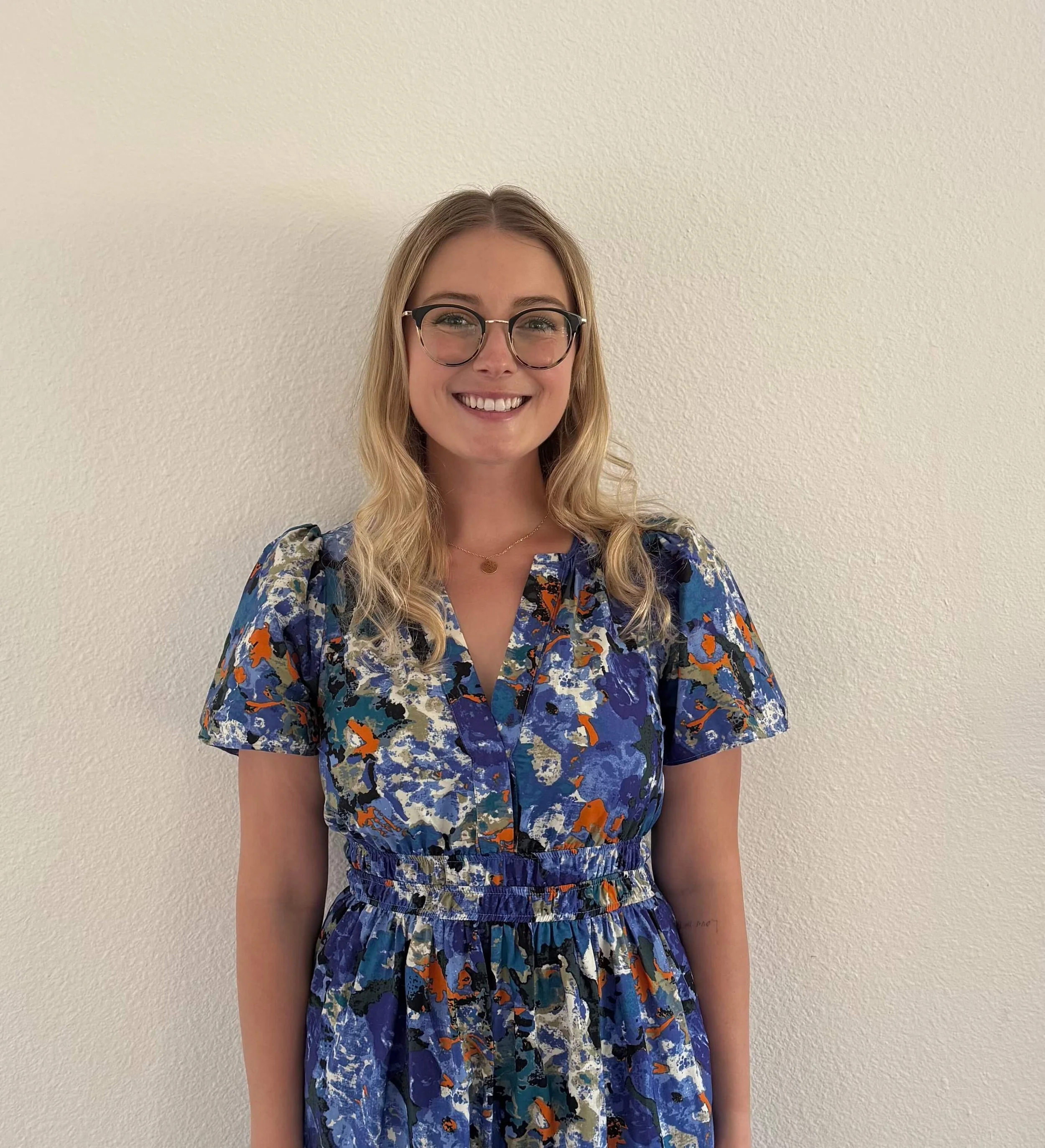 Jamie Seddon Hojnacki headshot in blue dress