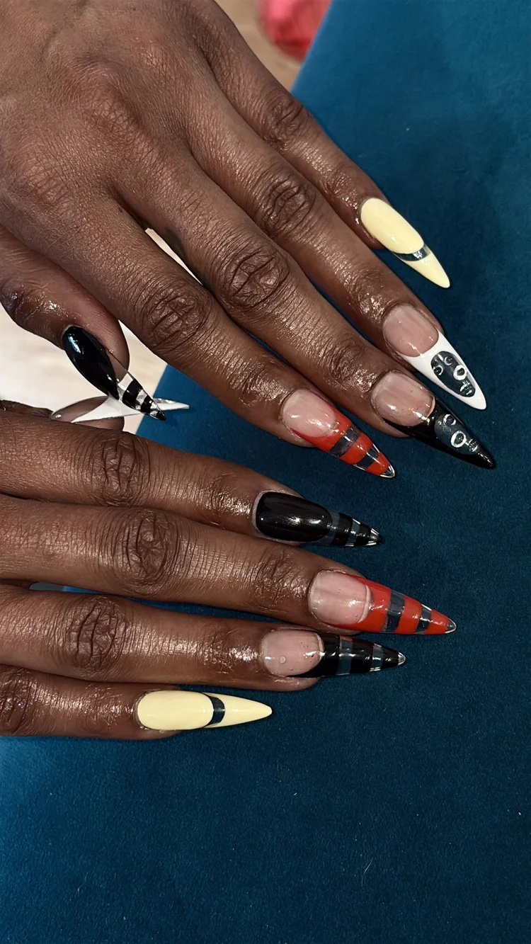 Reina nail art at Serene Nail Club NYC: Colorful patterned long almond nails