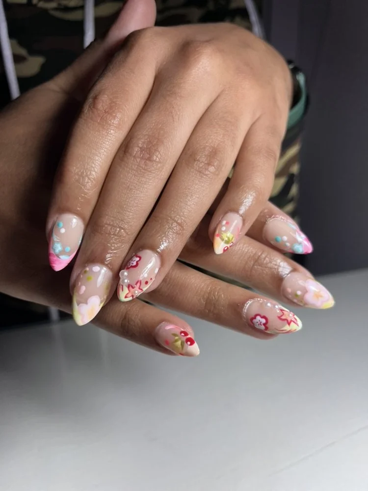 Cecilian nail art: Colorful florals and dots on almond nails