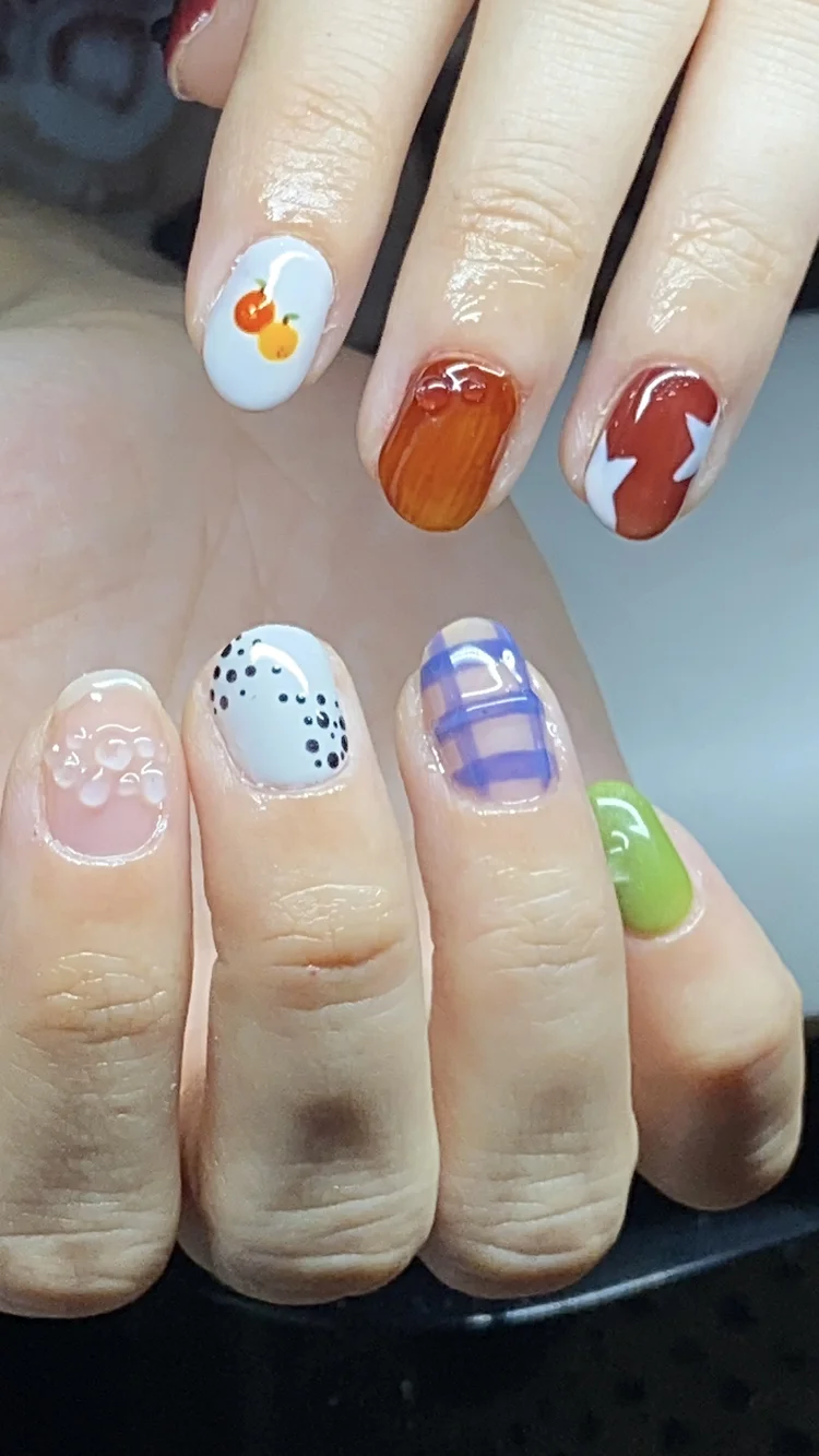 Alexis nail art at Serene Nail Club NYC: Colorful nail art with cherries, oranges, stars, spots and stripes