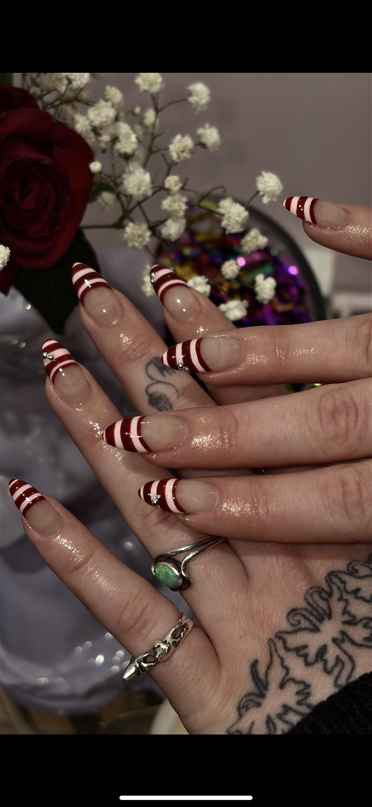Reina nail art at Serene Nail Club NYC: Red and white stripes with small rhinestones