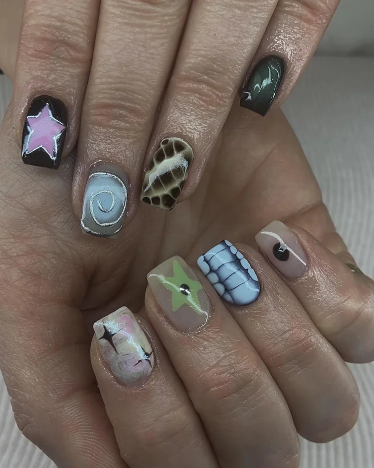 Alexis nail art at Serene Nail Club NYC: Stars, spirals, animal print, cracked ice and abstract designs in pastel and dark colors