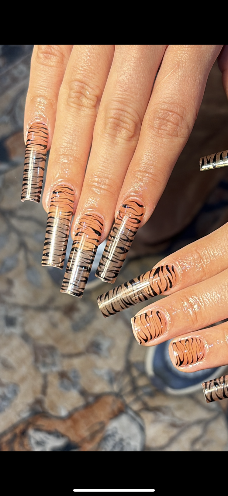 Reina nail art at Serene Nail Club NYC: Orange and black tiger stripes