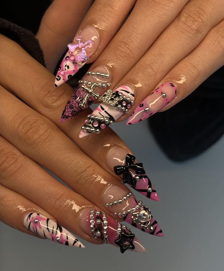 Natalie nail art at Serene Nail Club NYC: Pink, black and white leopard stilettos with bows and charms