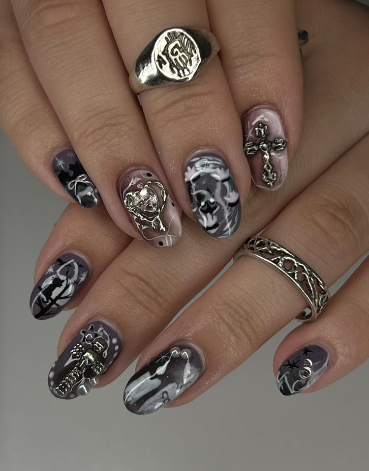 Natalie nail art at Serene Nail Club NYC: Black, white and gray holiday swirls with skulls, crosses and snowflakes