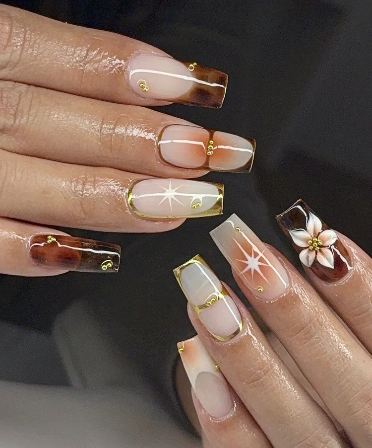 Reina nail art: White and gold florals and stars on short square natural nails