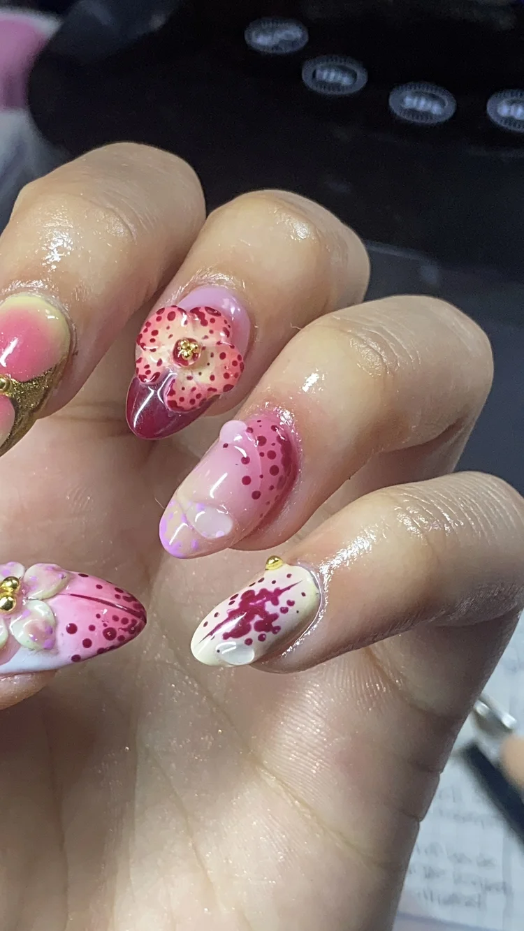 Alexis nail art: Pink, white and red floral nails with gold accents