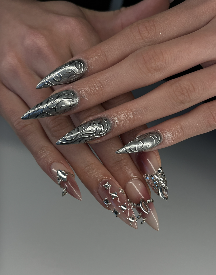 Natalie nail art at Serene Nail Club NYC: Metallic silver and pink with 3D swirls, spikes and rhinestones