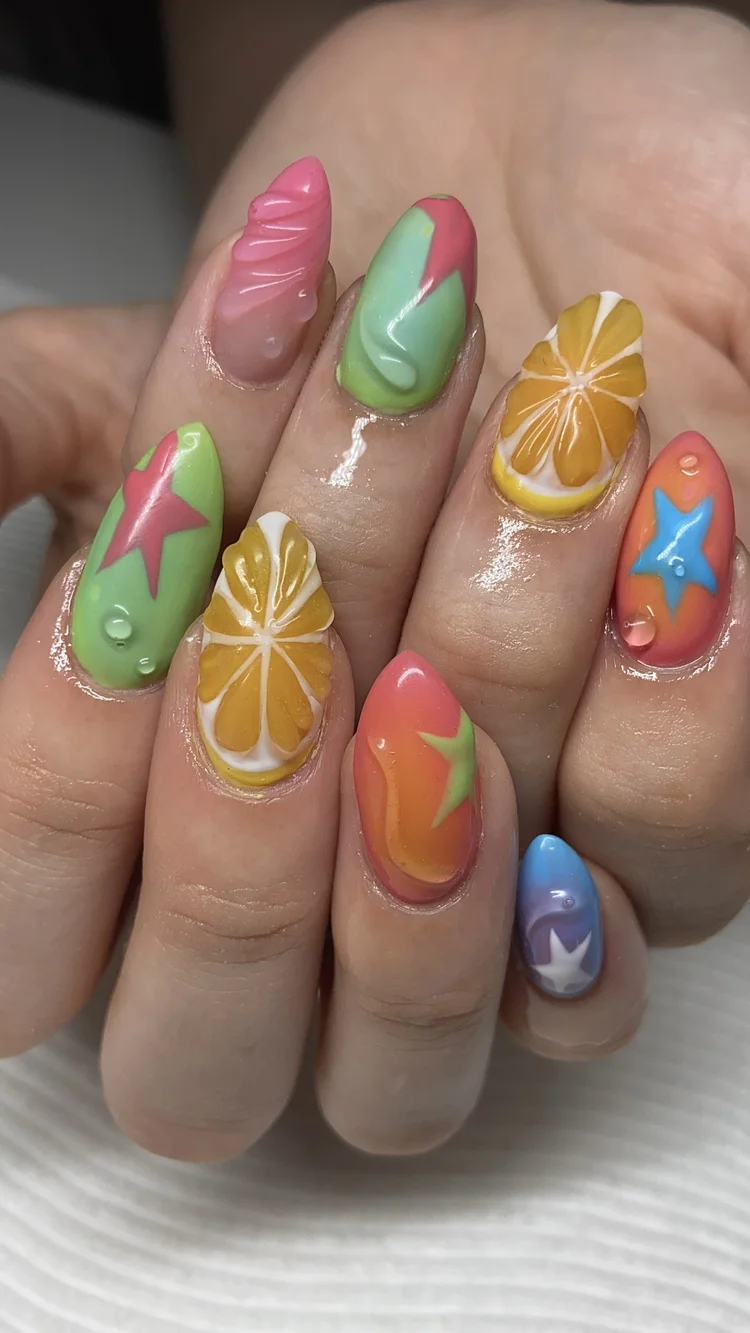 Alexis nail art at Serene Nail Club NYC: Colorful summer nail art with stars, citrus slices and abstract patterns