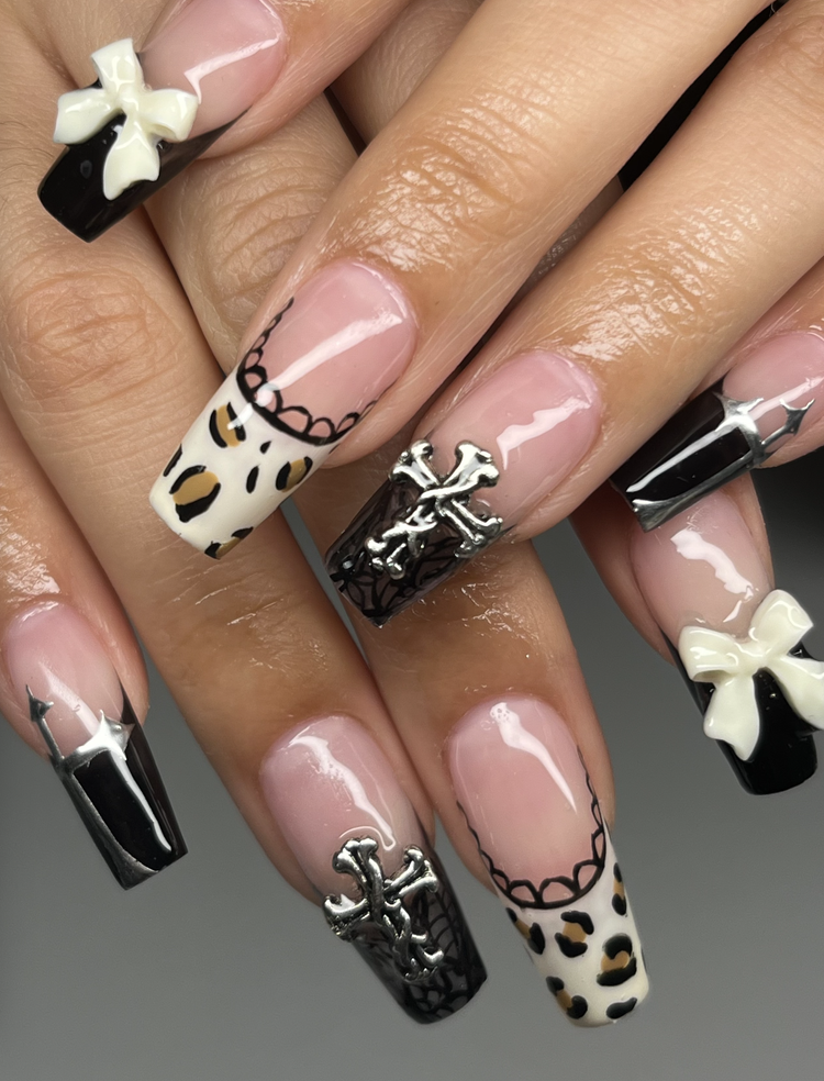 Natalie nail art: Black, white and leopard print with bows and silver crosses