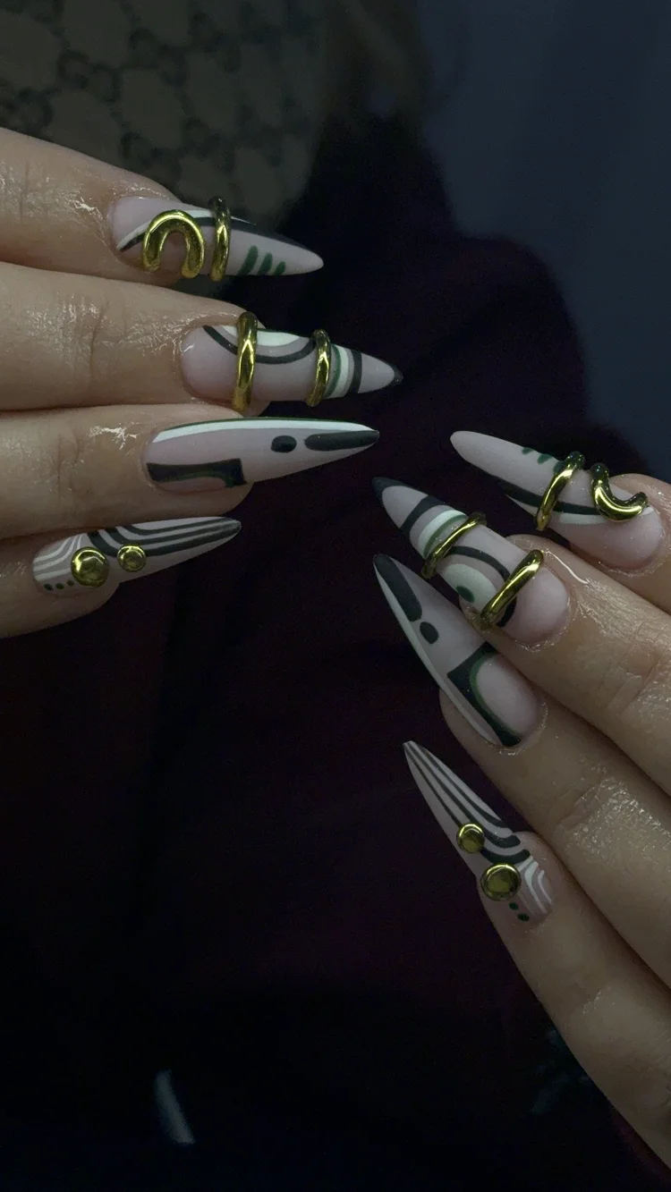 Reina nail art at Serene Nail Club NYC: Long pointed nails with abstract black and white designs