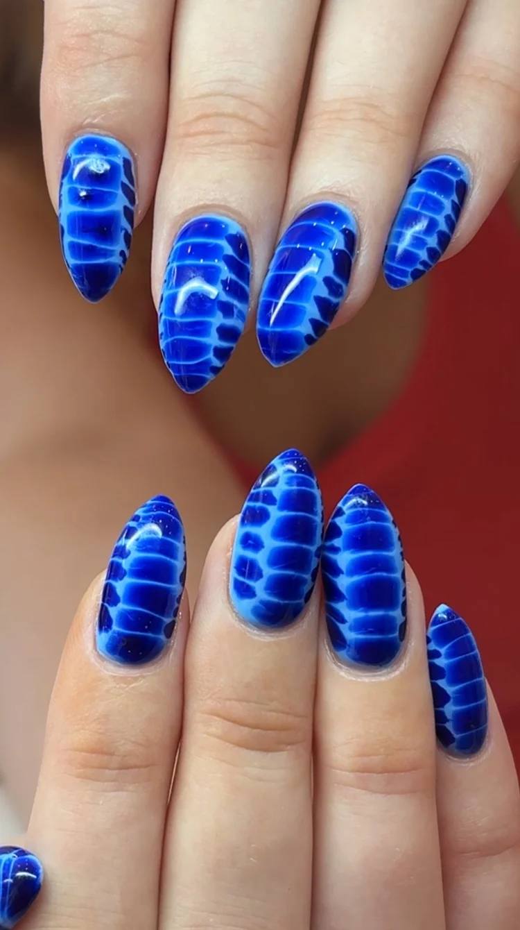 Alexis nail art: Long almond nails in a blue and white reptile skin pattern