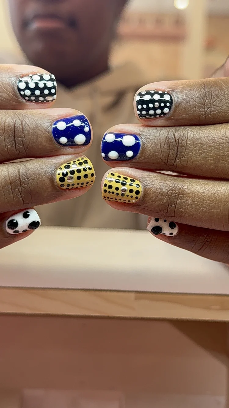 Alexis nail art at Serene Nail Club NYC: Polka dots in black, white, blue and yellow