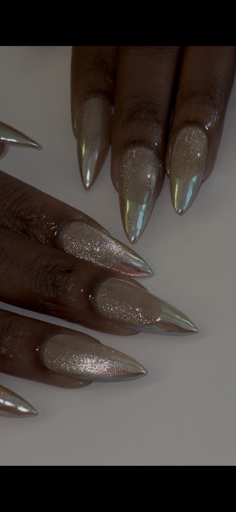 Reina nail art at Serene Nail Club NYC: Long pointed holographic glitter nails