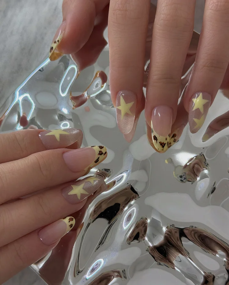 Iris nail art at Serene Nail Club NYC: Star and animal print designs