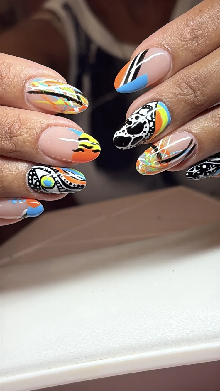 Alexis nail art at Serene Nail Club NYC: Neon and black abstract and tribal patterns on natural nails