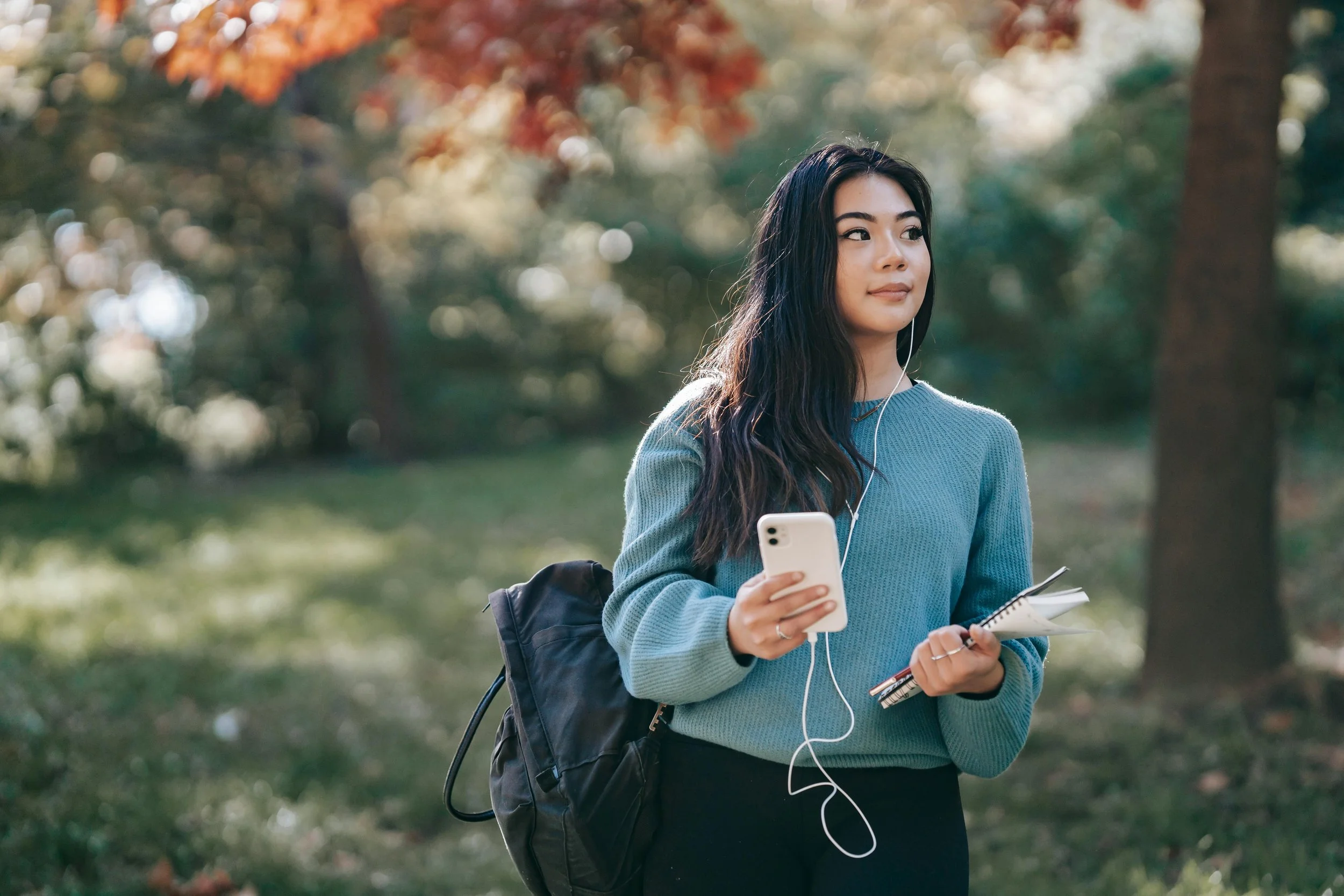 Woman sitting outside journaling as part of emotional healing and trauma recovery
