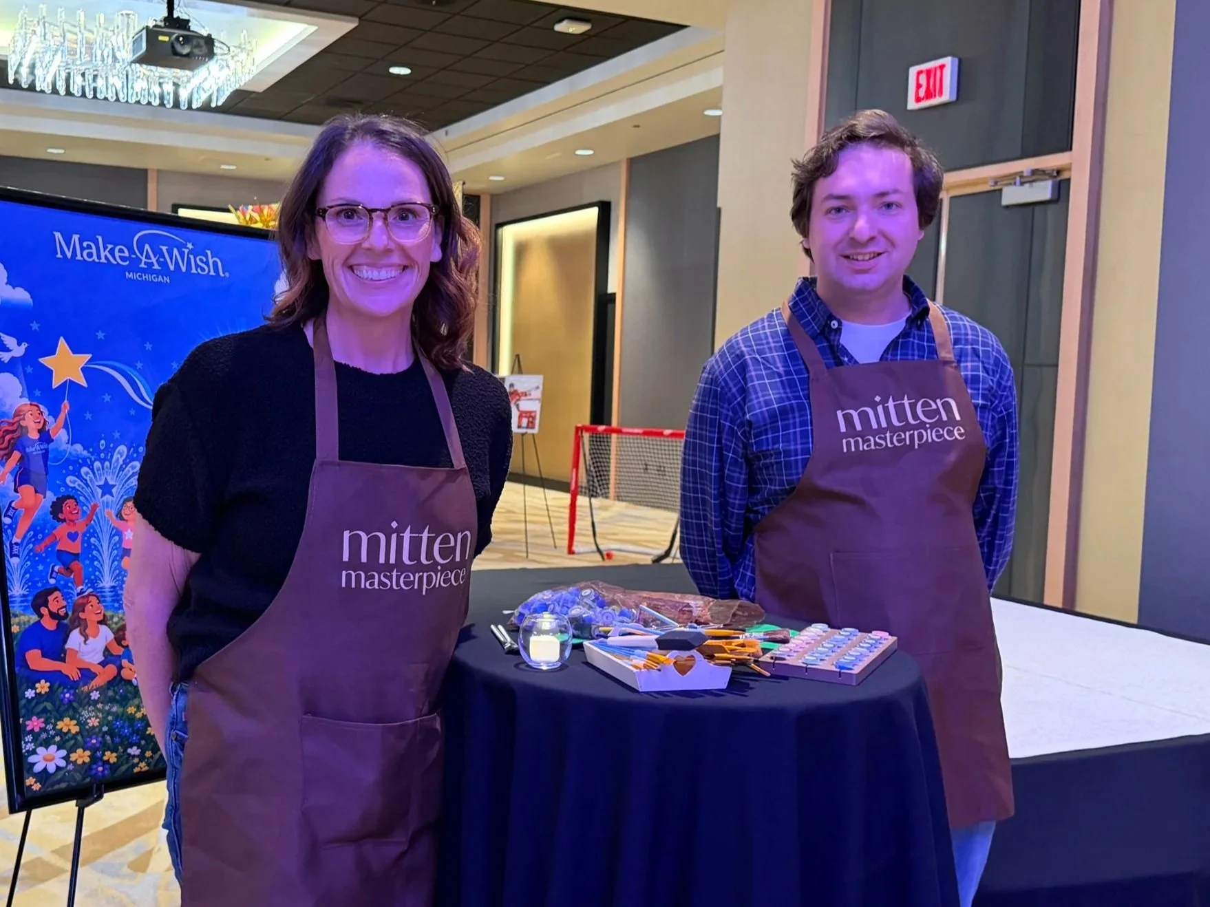Bobbie & Gavin Rathjens from Mitten Masterpiece at the Make-A-Wish Michigan Paint-by-Number Community Mural Event